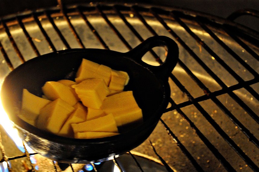 Melting queso on a charcoal grill
